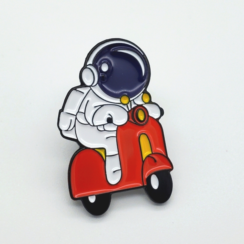Astronaut on a bike pin